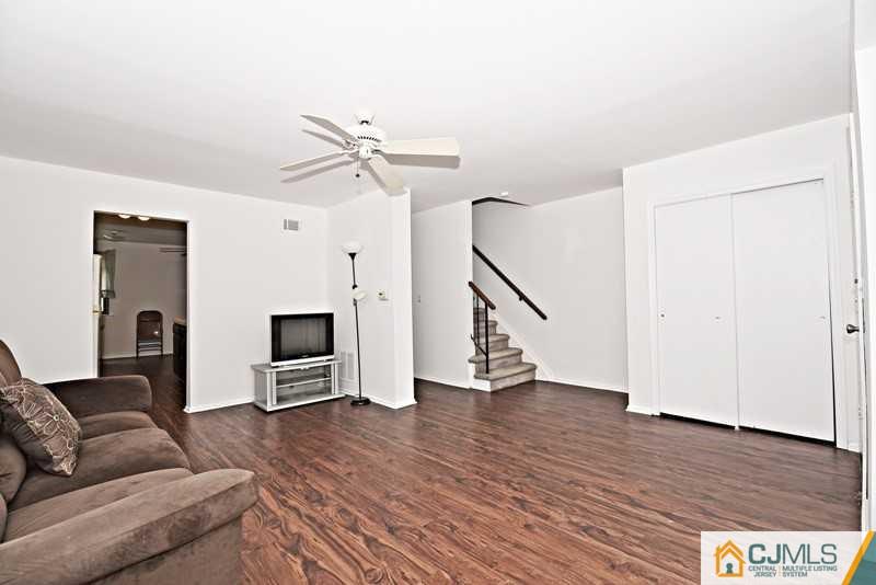 A9 Georges Road, Unit 9 Dayton, NJ 08810 - Photo 1 of 20 a living room with furniture and a wooden floor