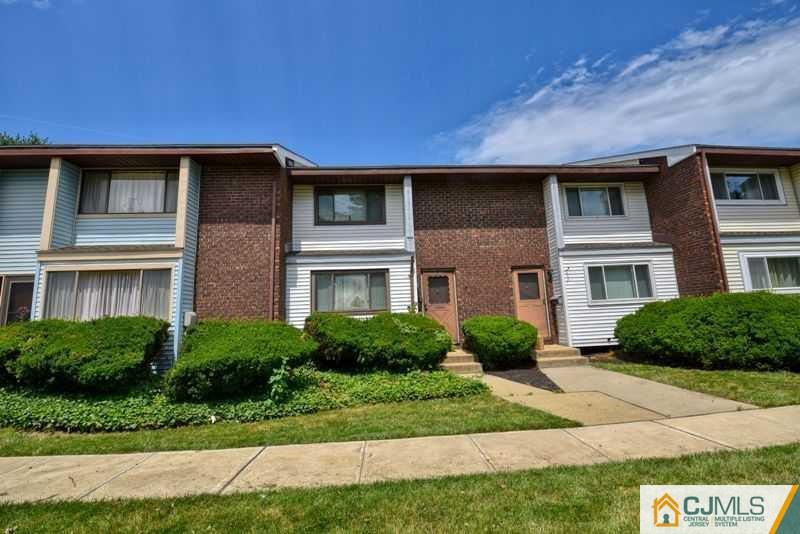 A9 Georges Road, Unit 9 Dayton, NJ 08810 - Photo 20 of 20 a front view of a house with garden