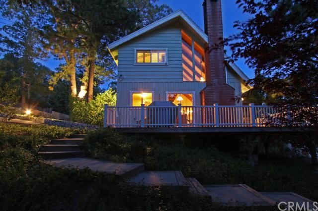 a view of house with outdoor space and garden