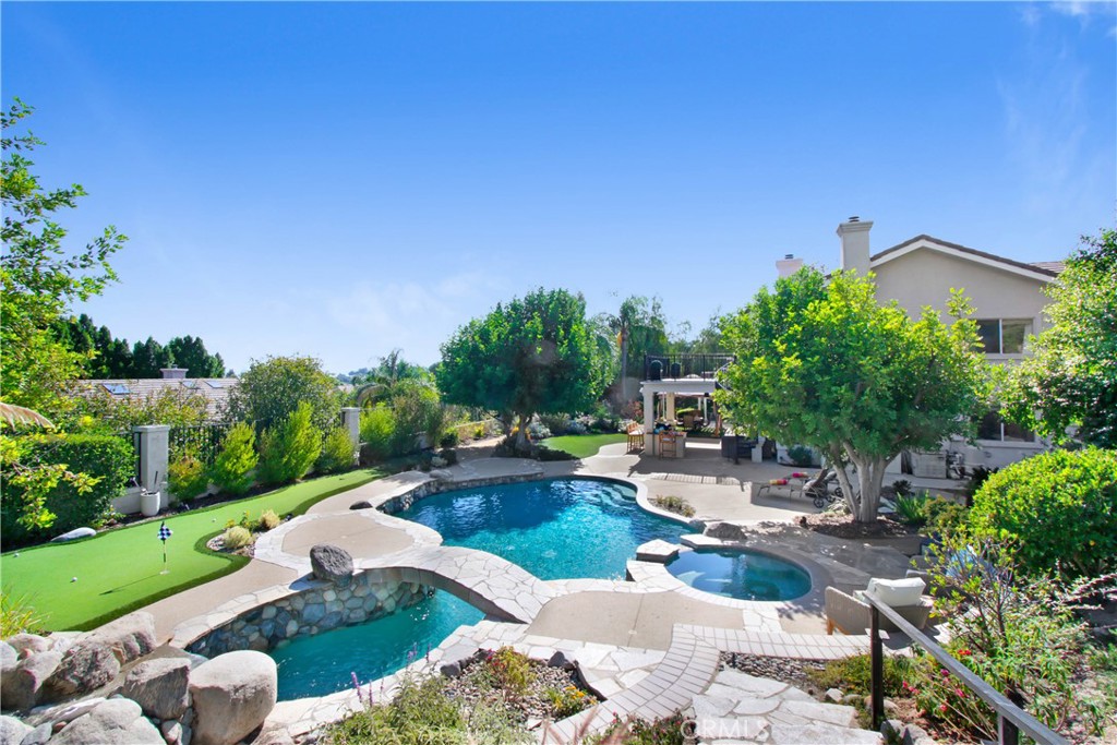 12036 Wood Ranch Road Granada Hills, CA 91344 - Photo 1 of 55 Pebble Tech Pool with Bridge, Waterfall and Solar Heating