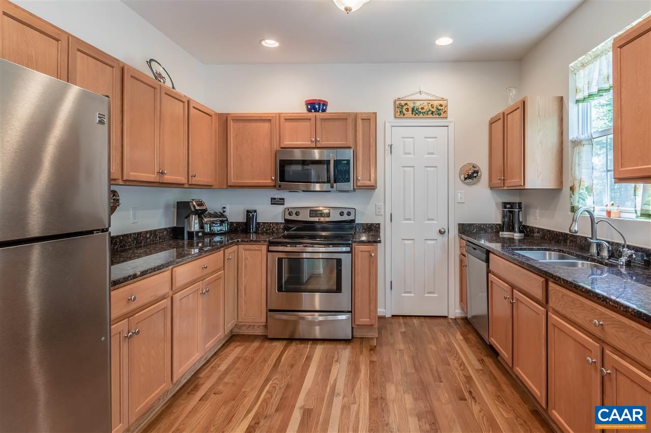 251 Morning Glory Road Ruckersville, VA 22968 - Photo 13 of 36 a kitchen with stainless steel appliances a refrigerator sink and microwave