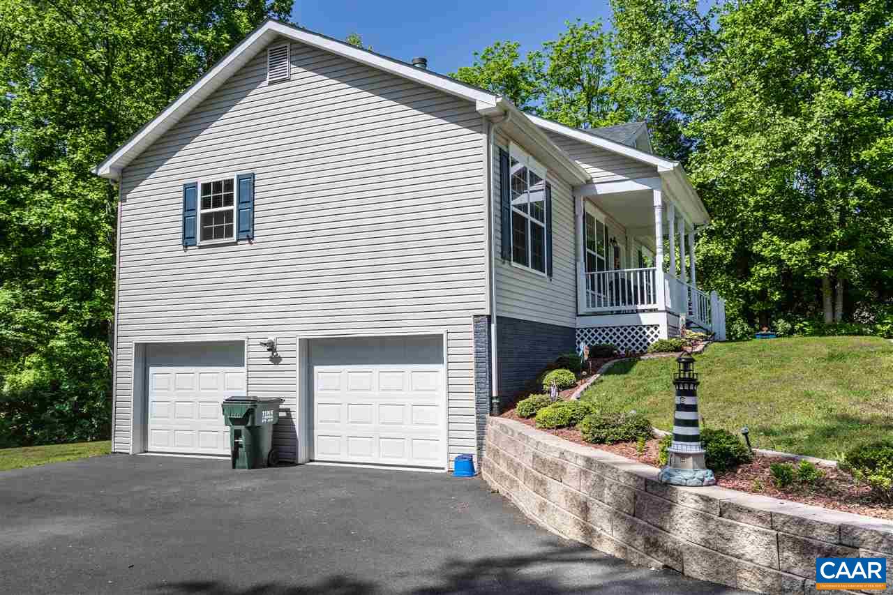 251 Morning Glory Road Ruckersville, VA 22968 - Photo 3 of 36 a view of a house with a yard and a large tree