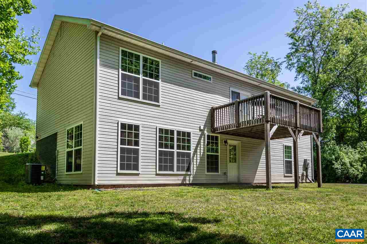 251 Morning Glory Road Ruckersville, VA 22968 - Photo 5 of 36 a front view of a house with a garden