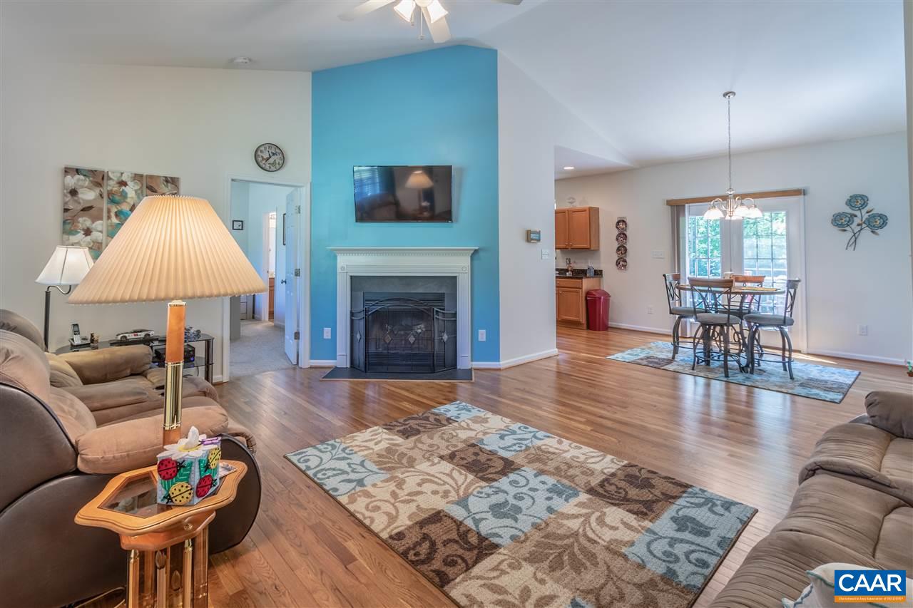 251 Morning Glory Road Ruckersville, VA 22968 - Photo 8 of 36 a living room with furniture and a wooden floor