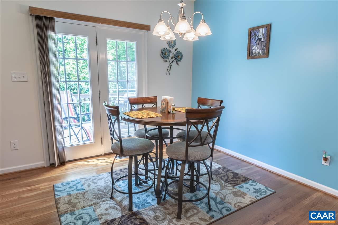 251 Morning Glory Road Ruckersville, VA 22968 - Photo 10 of 36 a view of a dining room with furniture window and wooden floor