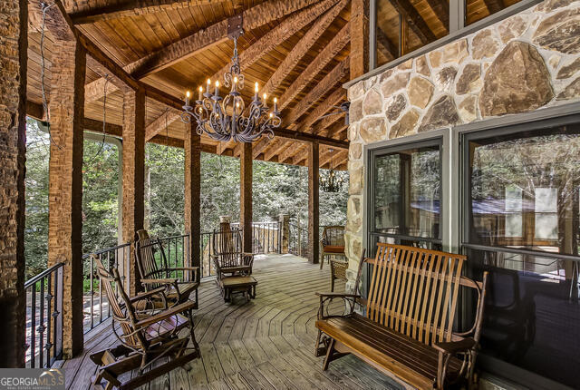 1760 Rickman Airfield Road Tiger, GA 30576 - Photo 12 of 38 a view of living room with furniture and floor to ceiling window