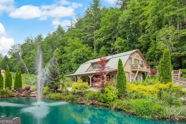 a view of balcony with a swing and wooden fence