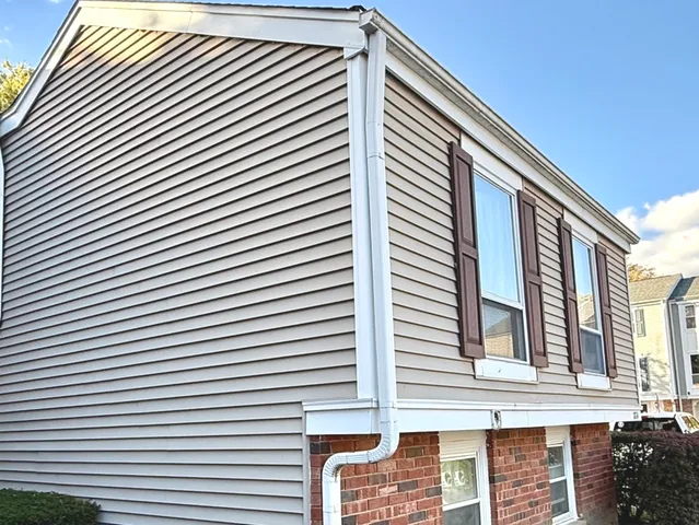 a view of a house with white walls