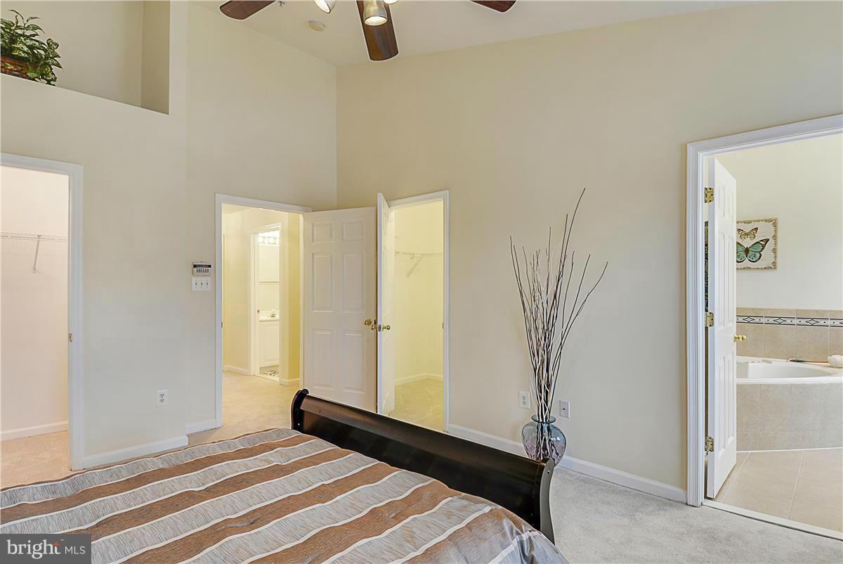 11344 King George Drive, Unit 5 Silver Spring, MD 20902 - Photo 20 of 30 a bedroom with a bed and a shower