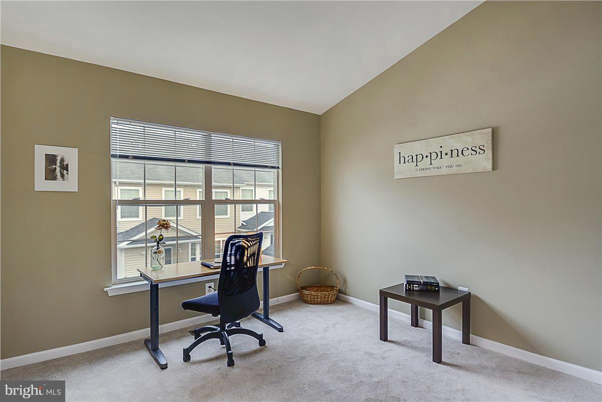 11344 King George Drive, Unit 5 Silver Spring, MD 20902 - Photo 24 of 30 a view of a workspace with furniture and a window