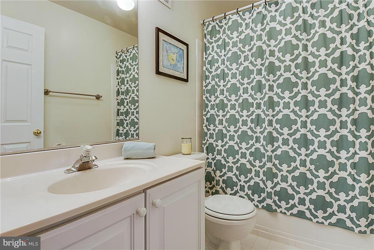 11344 King George Drive, Unit 5 Silver Spring, MD 20902 - Photo 25 of 30 a bathroom with a sink toilet and a mirror