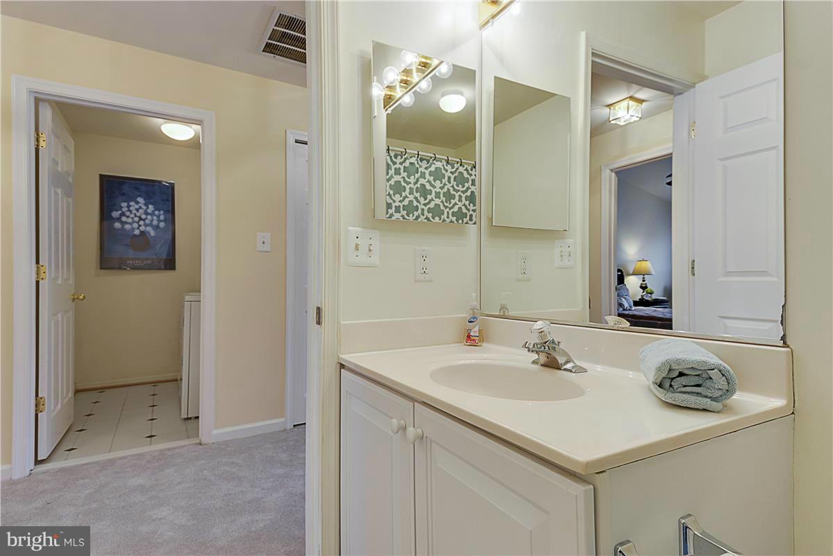 11344 King George Drive, Unit 5 Silver Spring, MD 20902 - Photo 26 of 30 a bathroom with a sink and a mirror