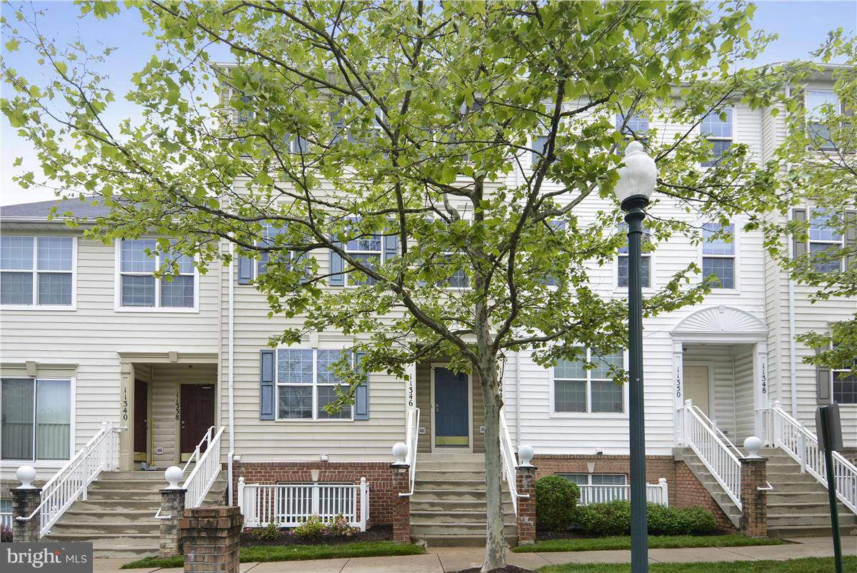 11344 King George Drive, Unit 5 Silver Spring, MD 20902 - Photo 6 of 30 a front view of a house with a yard