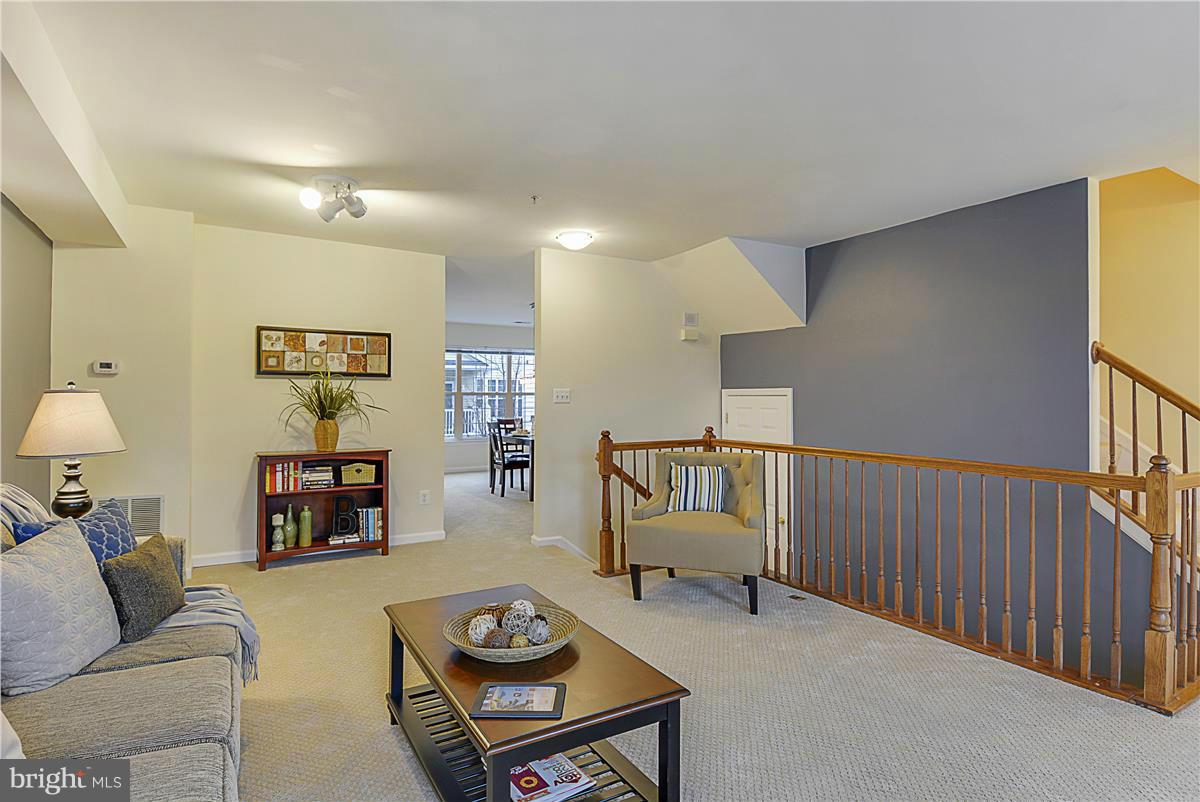 11344 King George Drive, Unit 5 Silver Spring, MD 20902 - Photo 10 of 30 a living room with furniture and wooden floor