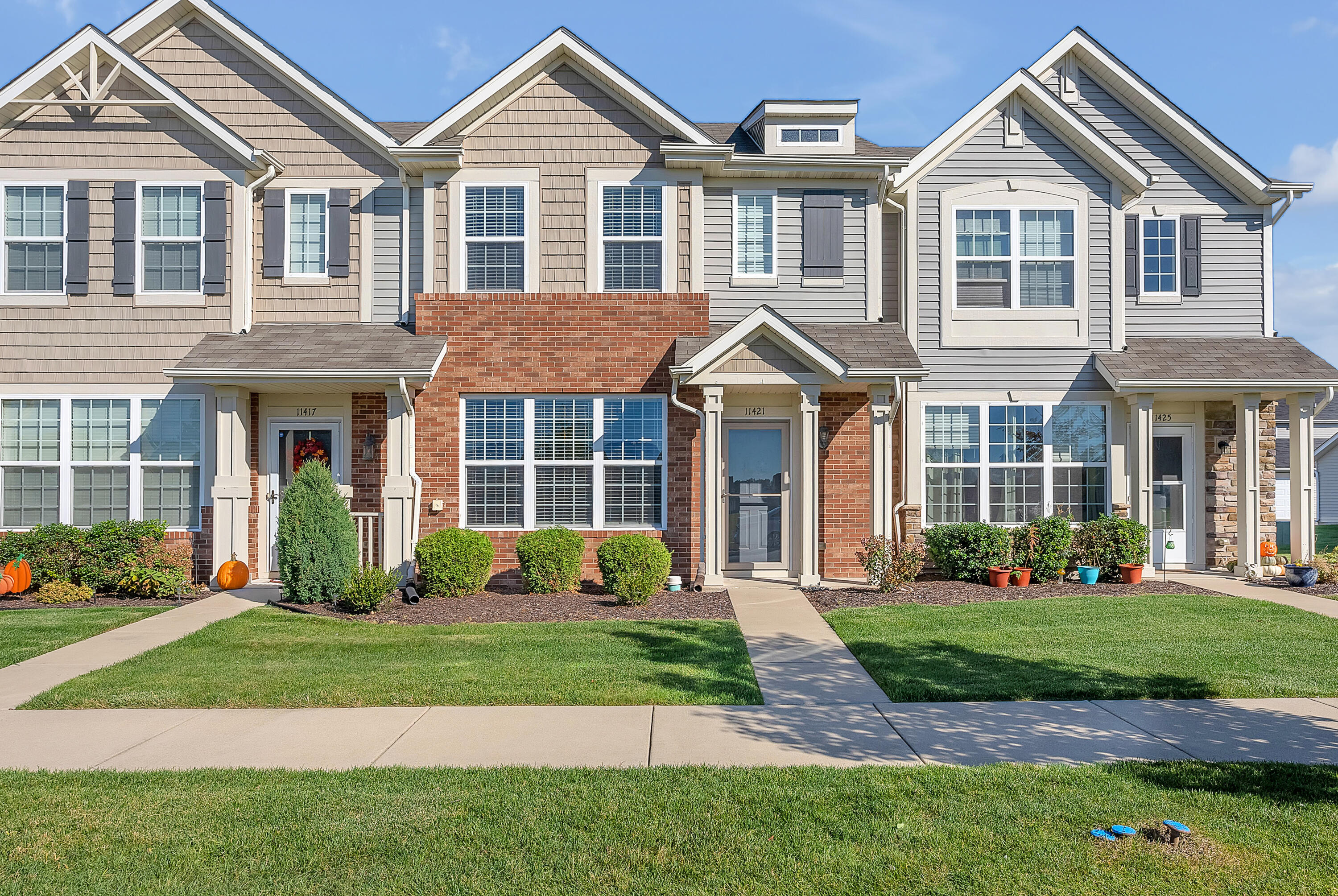a front view of a house with a yard