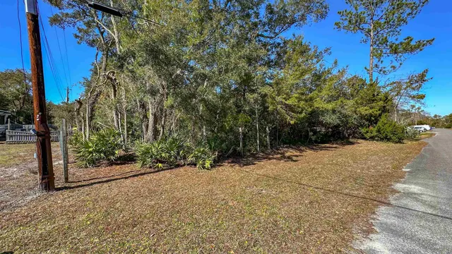 a view of a road with a building in the background