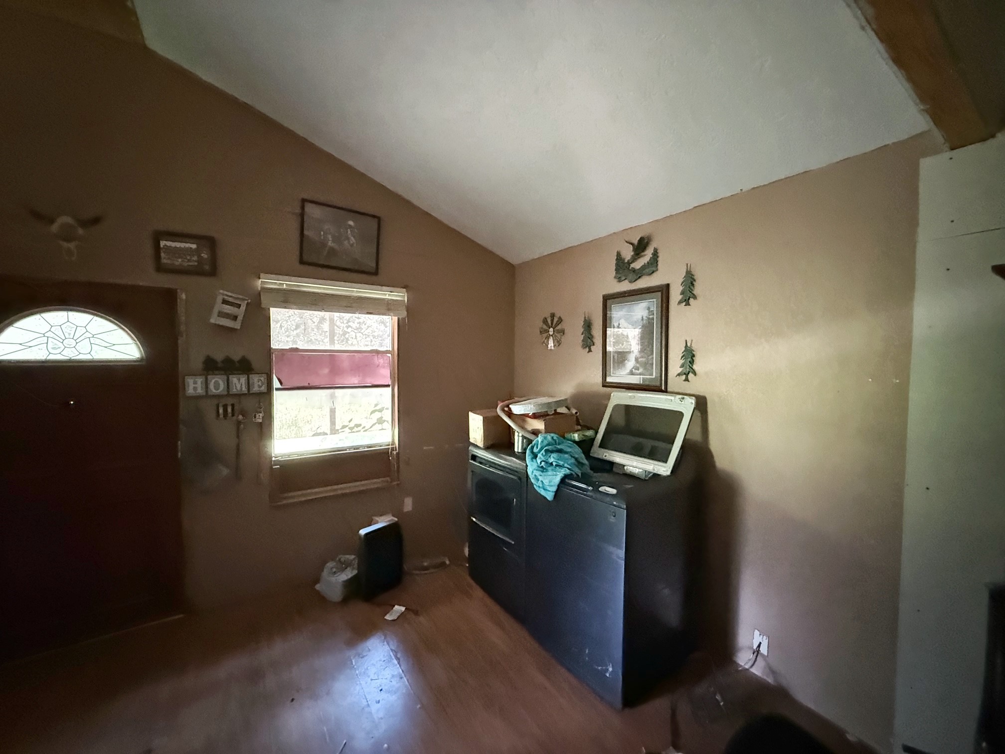 1491 County Road 1464 Centerville, TX 75833 - Photo 13 of 19 a room with window dryer and wooden floor