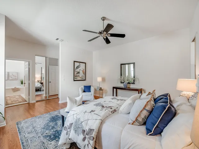 a bathroom with a sink a tub and a mirror
