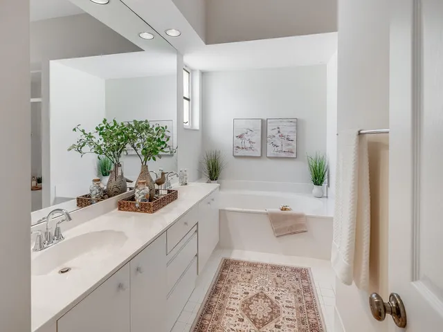 a bathroom with a bathtub and shower
