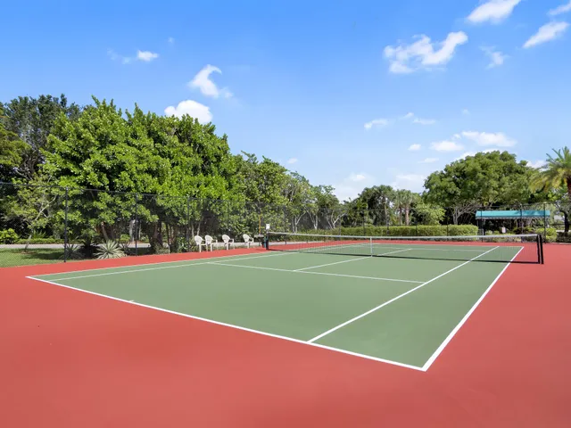 a view of an outdoor space and tennis court