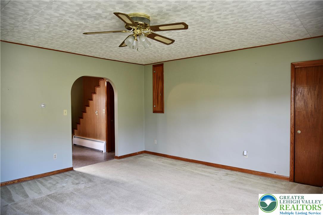 238 Grim Road Kutztown, PA 19530 - Photo 7 of 27 an empty room with a chandelier fan and closet