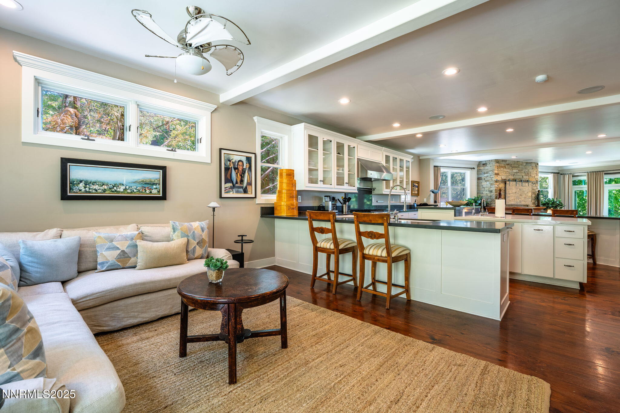 1964 Glenbrook House Road Glenbrook, NV 89413 - Photo 13 of 42 a living room with stainless steel appliances kitchen island granite countertop furniture wooden floor and a large window