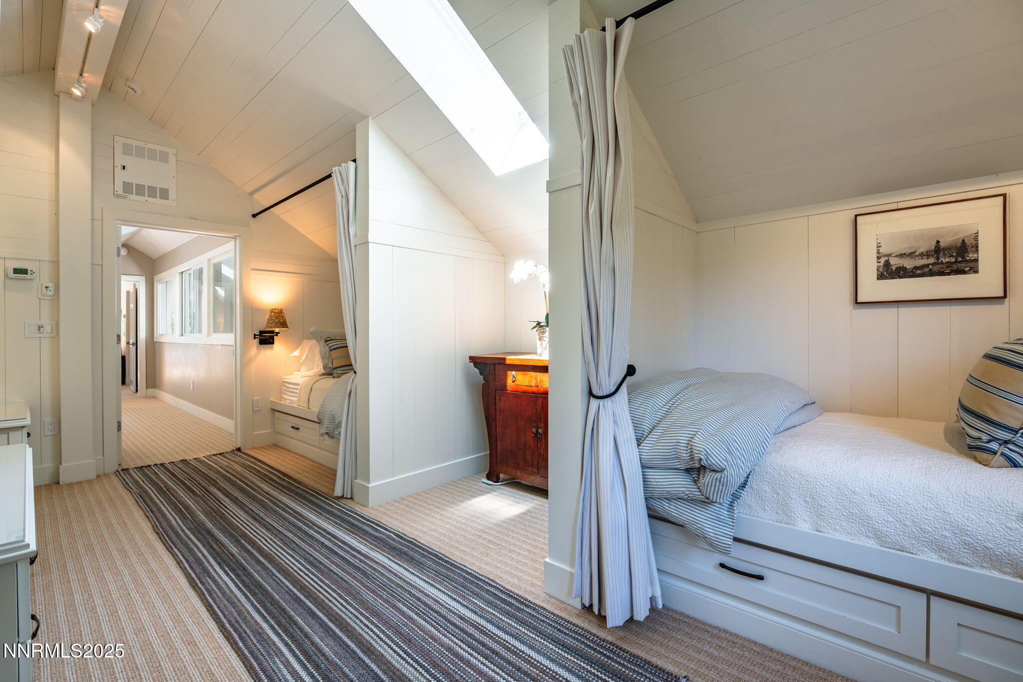 1964 Glenbrook House Road Glenbrook, NV 89413 - Photo 27 of 42 a bedroom with a bed and wooden floor