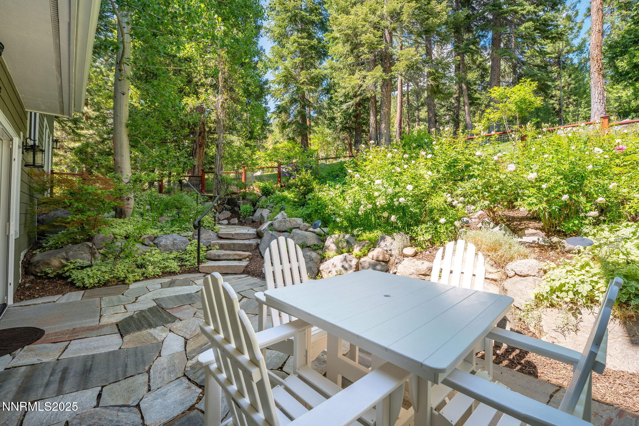 1964 Glenbrook House Road Glenbrook, NV 89413 - Photo 31 of 42 a view of a patio with table and chairs and potted plants