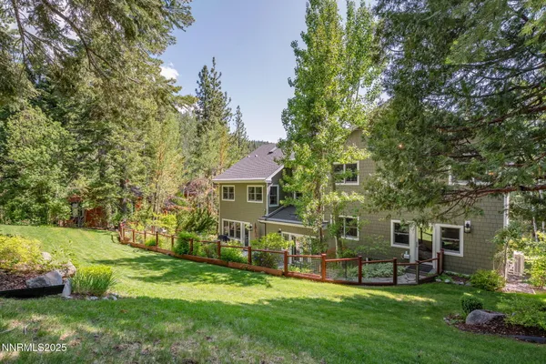 a view of a house with a yard porch and sitting area