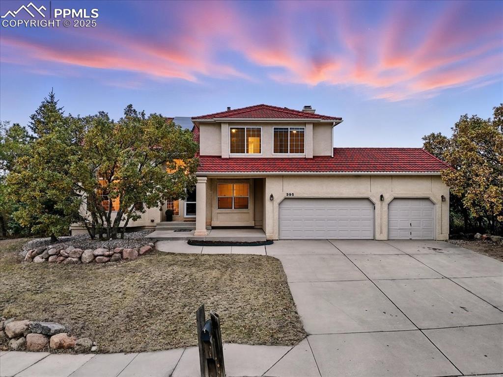 395 Cardiff Circle Colorado Springs, CO 80906 - Photo 1 of 31 a front view of a house with garden