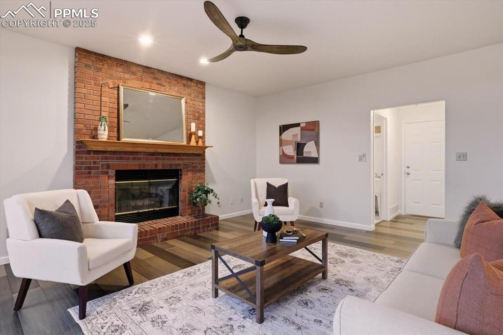 395 Cardiff Circle Colorado Springs, CO 80906 - Photo 12 of 31 a living room with furniture and a fireplace