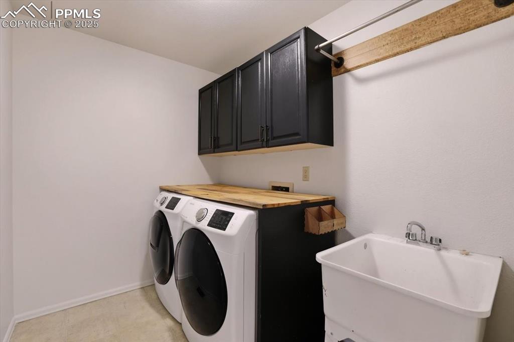 395 Cardiff Circle Colorado Springs, CO 80906 - Photo 15 of 31 a utility room with dryer and washer