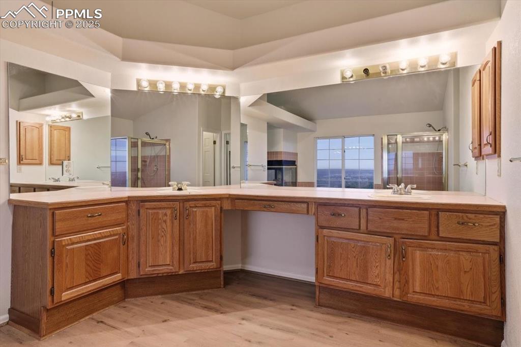 395 Cardiff Circle Colorado Springs, CO 80906 - Photo 18 of 31 a spacious bathroom with a sink vanity and mirror