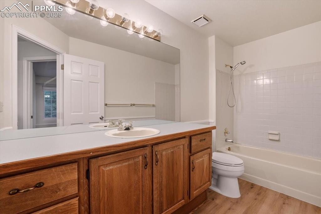 395 Cardiff Circle Colorado Springs, CO 80906 - Photo 23 of 31 a bathroom with a sink a toilet and shower