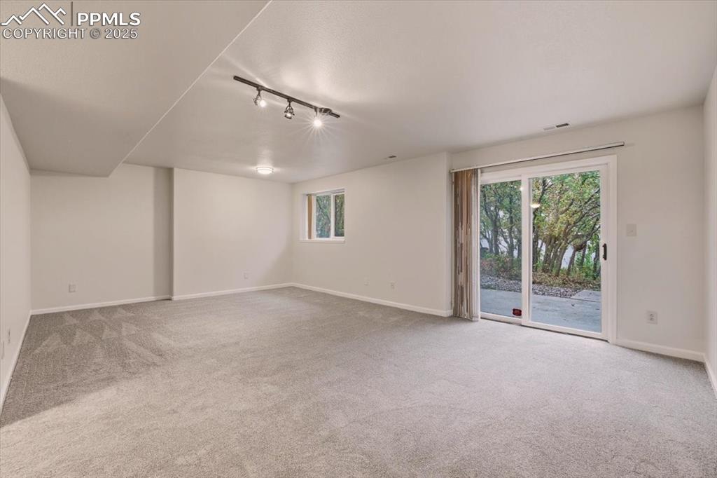 395 Cardiff Circle Colorado Springs, CO 80906 - Photo 25 of 31 a view of empty room with floor to ceiling window