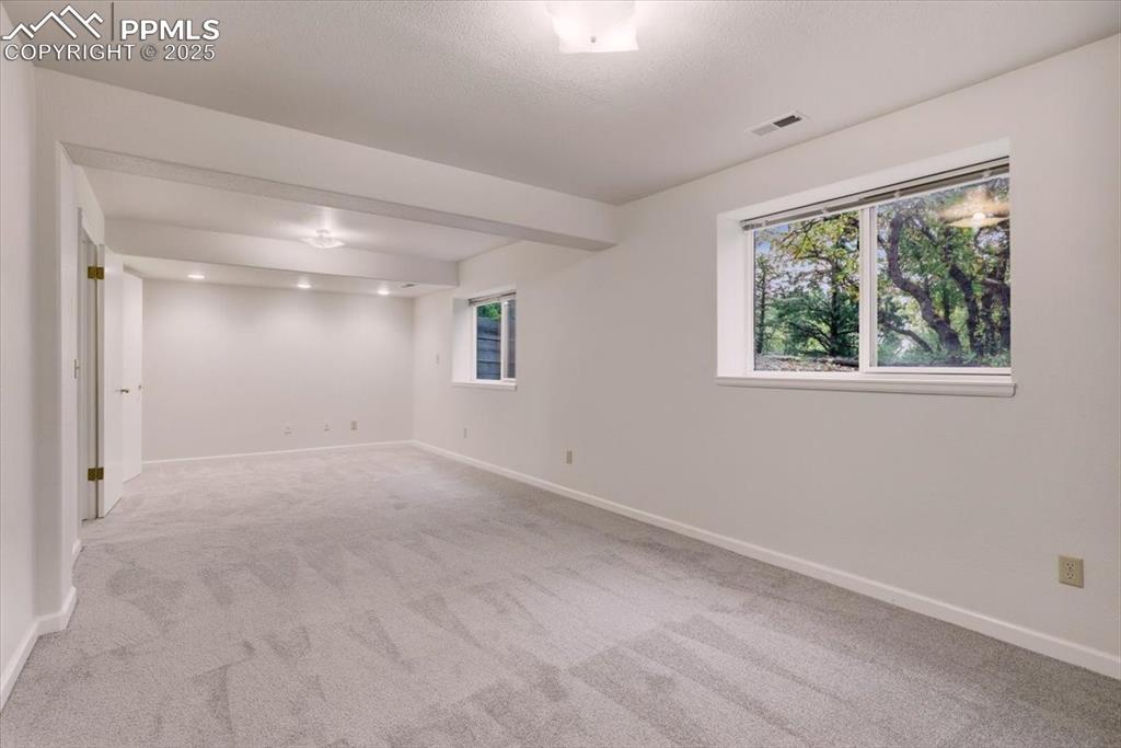 395 Cardiff Circle Colorado Springs, CO 80906 - Photo 26 of 31 a view of an empty room with a window
