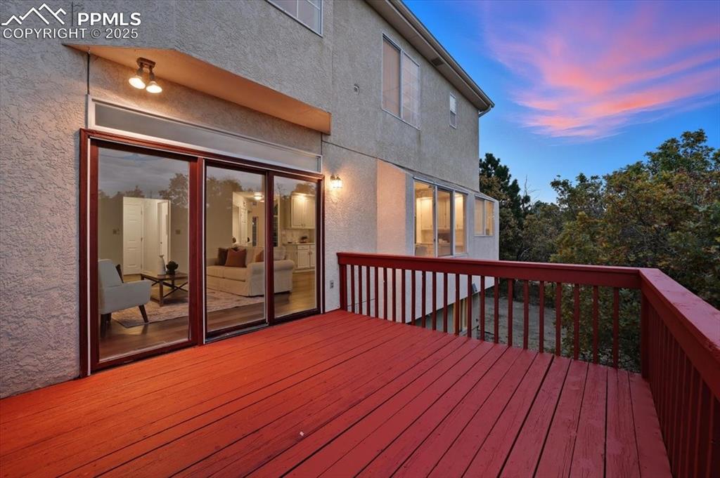 395 Cardiff Circle Colorado Springs, CO 80906 - Photo 28 of 31 a balcony with wooden floor and city view