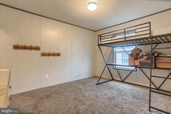 a view of a room with rack and wooden floor