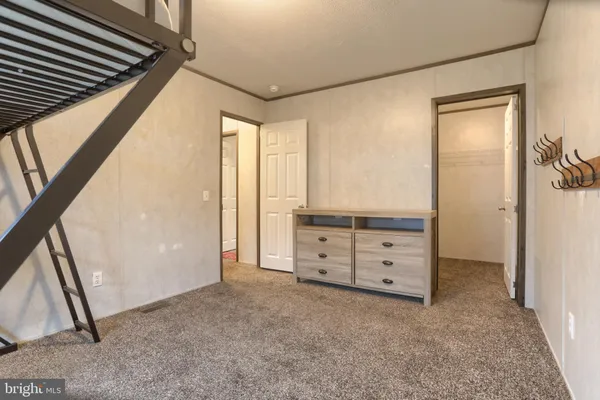 a view of room with window and cabinet