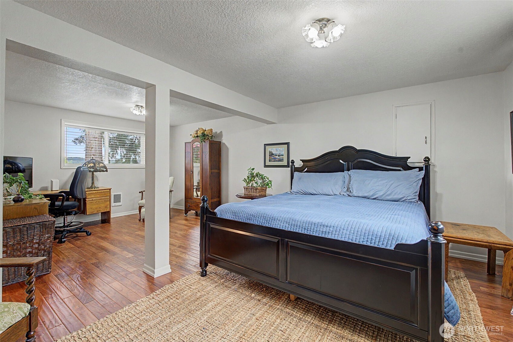 1611 Ham Hill Road Centralia, WA 98531 - Photo 27 of 40 a bedroom with a bed and wooden floor