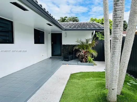 a bedroom with a bed and a a mirror