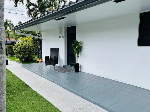 an aerial view of a house with outdoor space