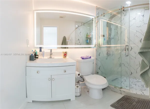 a view of a patio with a table and chairs