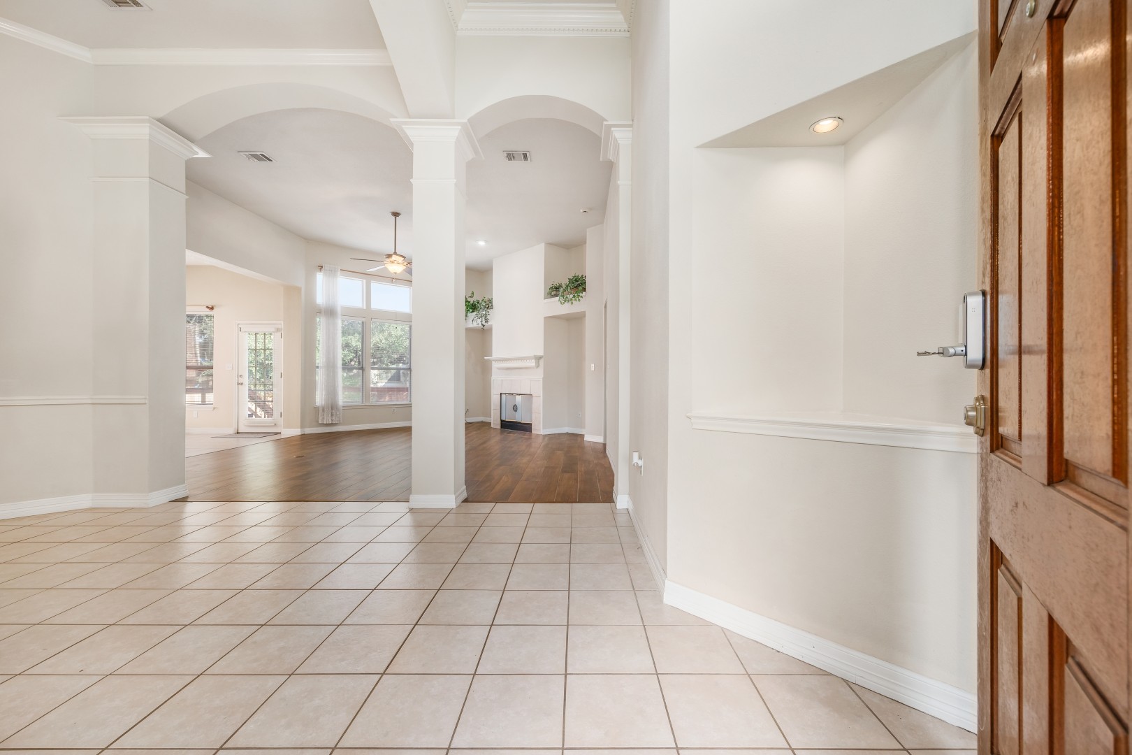 1108 Antelope Ridge Cedar Park, TX 78613 - Photo 27 of 39 Elegant arches and classic crown molding frame a welcoming entry with durable tile flooring.