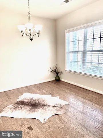 a view of a room with a empty space and a window