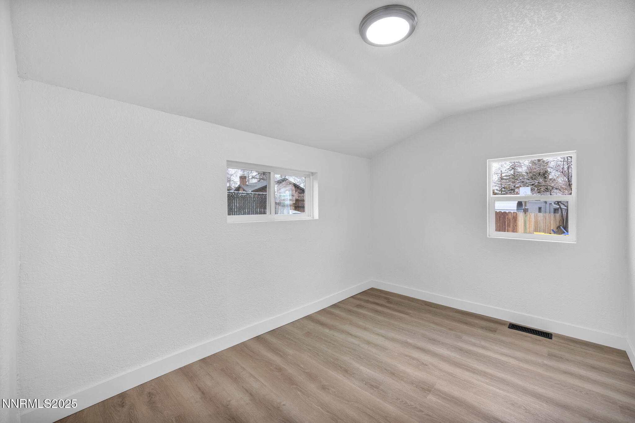 1080 Bell Street Reno, NV 89503 - Photo 17 of 33 a view of a room with wooden floor and window