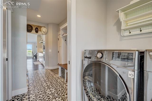 24076 Kobilan Road Calhan, CO 80808 - Photo 16 of 50 Laundry room with washer / dryer and light tile floors