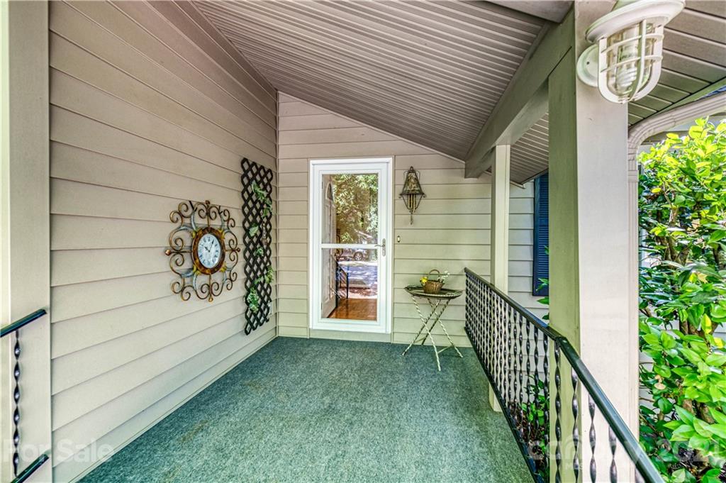 23055 Point Clear Drive, Unit 5 Tega Cay, SC 29708 - Photo 2 of 45 a view of a porch with wooden floor