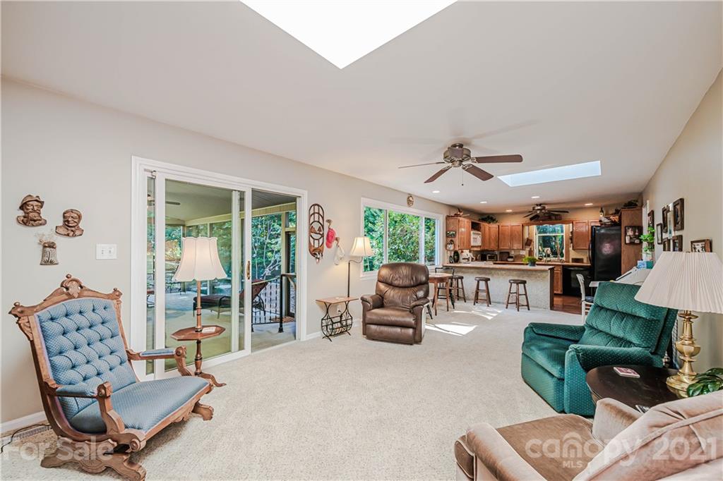 23055 Point Clear Drive, Unit 5 Tega Cay, SC 29708 - Photo 11 of 45 a living room with furniture and a large window