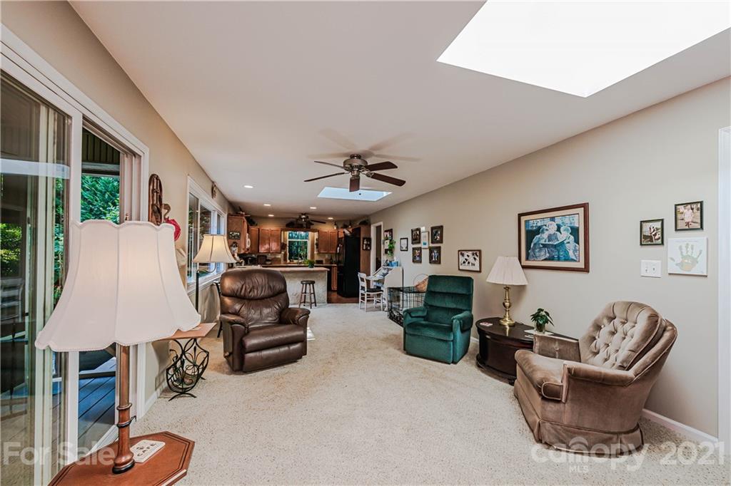 23055 Point Clear Drive, Unit 5 Tega Cay, SC 29708 - Photo 12 of 45 a living room with furniture and a fireplace